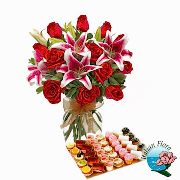 Bouquet of red roses and pink lilies with sweets